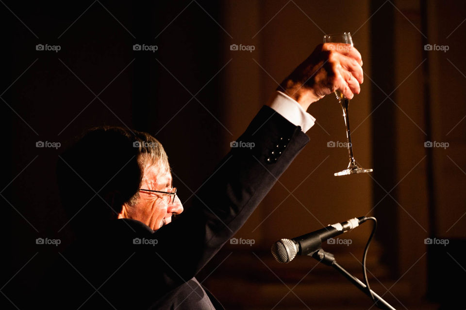 man toast champagne microphone by richfordphotog