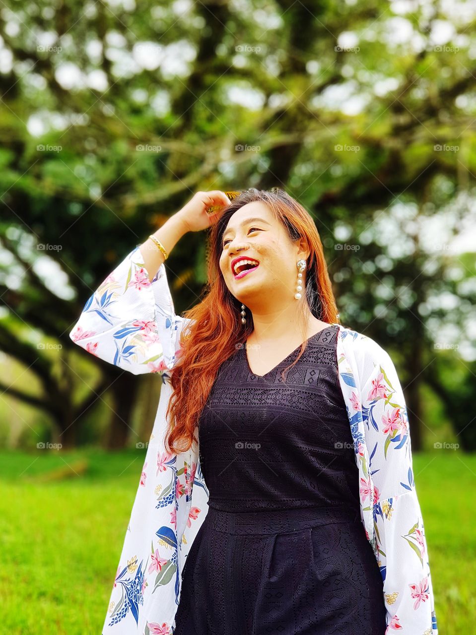 Smiling Asian woman in nature