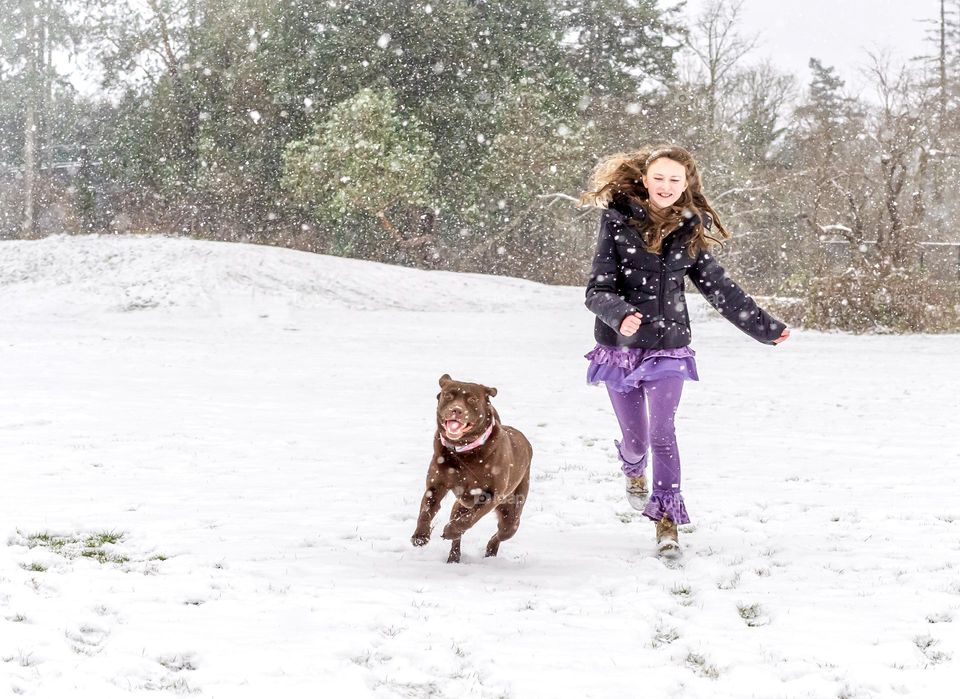 Girl running with her dog