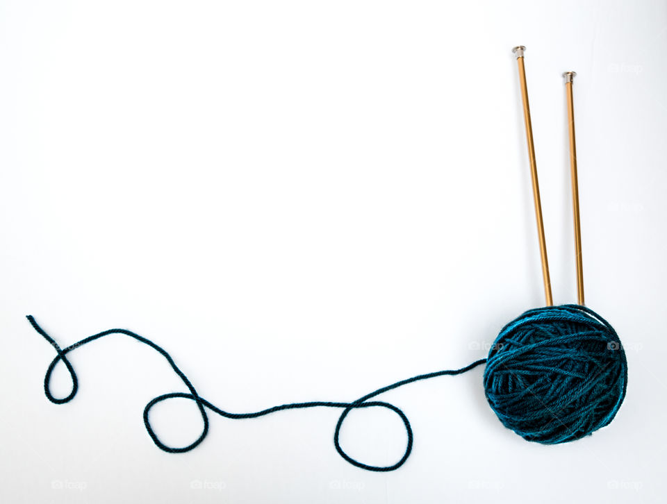 Blue Ball of Yarn and Knitting Needles