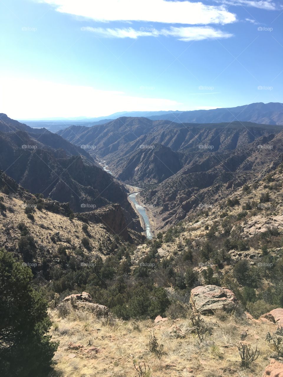 Beautiful cliff over looking the valley of Royal Gorge, with a cold yet gorgeous river that cuts through perfectly. 