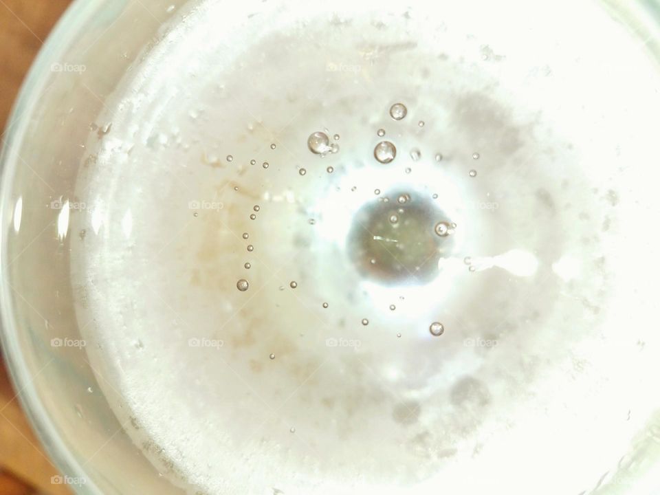 The fizzy bubbles of a refreshing drink...