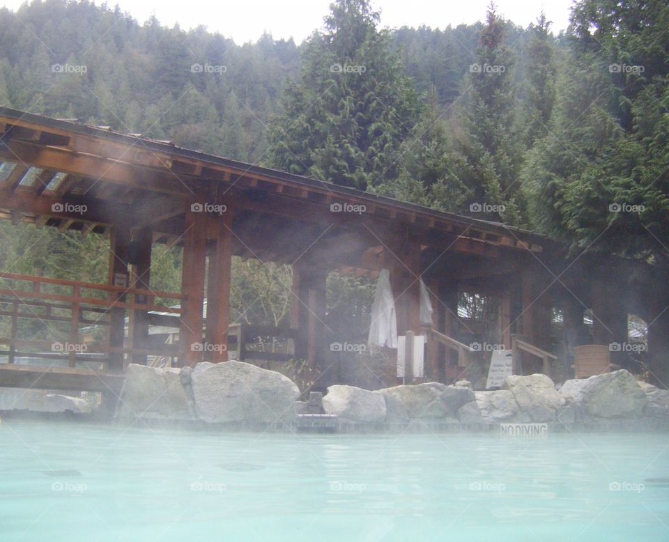 Spa Steam over harrison hot springs water and wooden bridge walkway