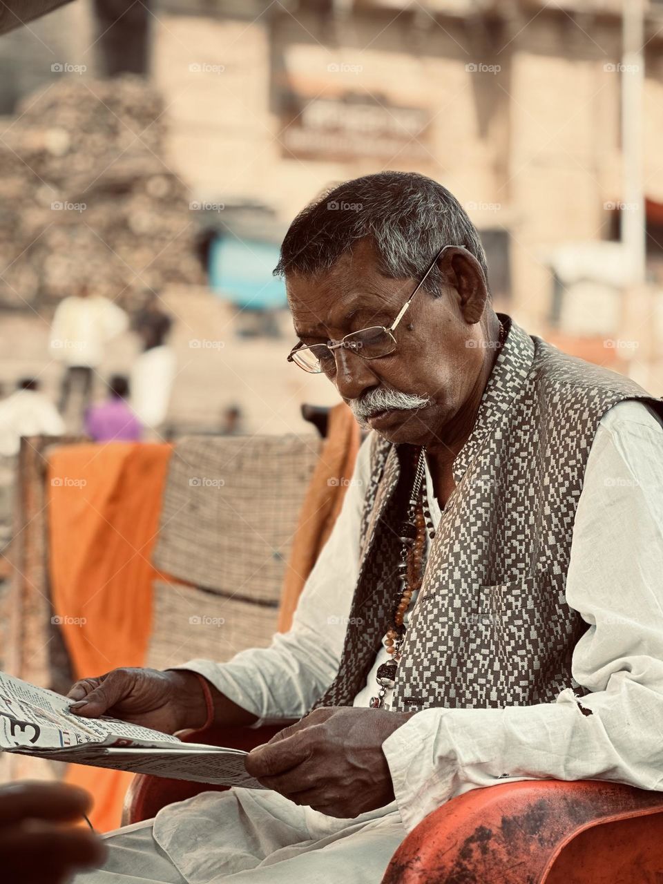 Time to read the newspaper in Varanasi, India