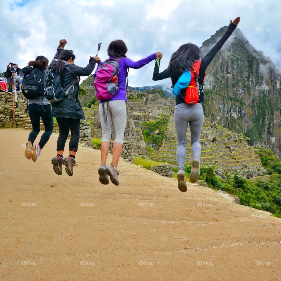 Four friends celebrate traveling together