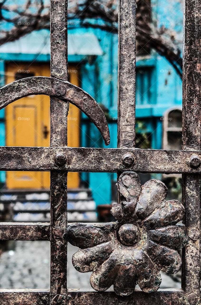 Orange-blue shades behind the old door