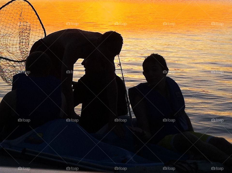 Youth sunset fishing on lake, silhouette. Youth sunset fishing on lake, silhouette