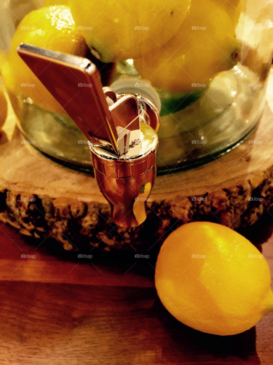 Lemon Spout. A glass pitcher filled with lemons.