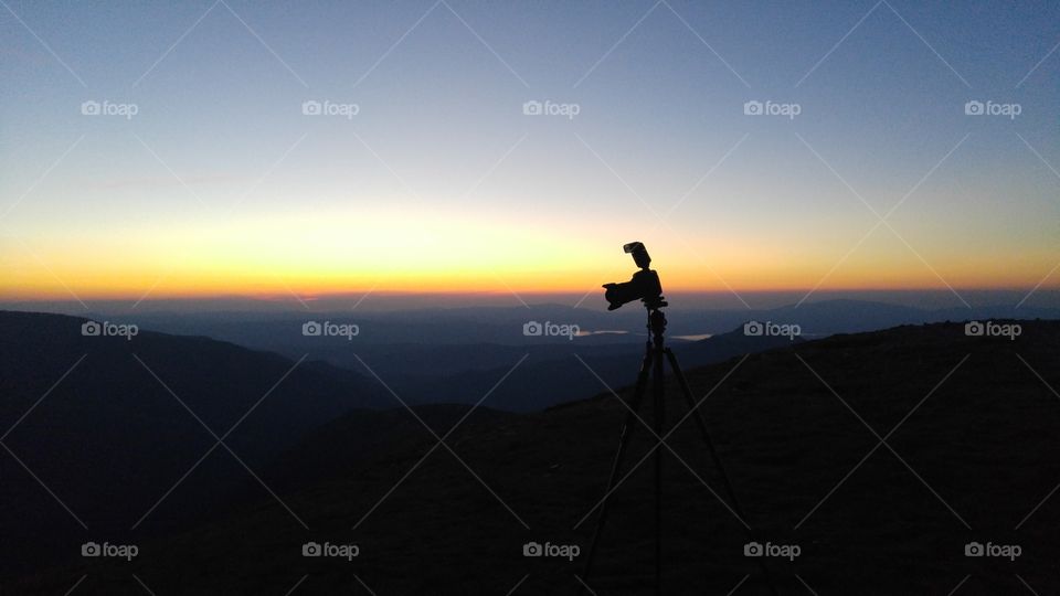 A camera in a beautiful mountain sunset in Tatry mountains, Slovakia
