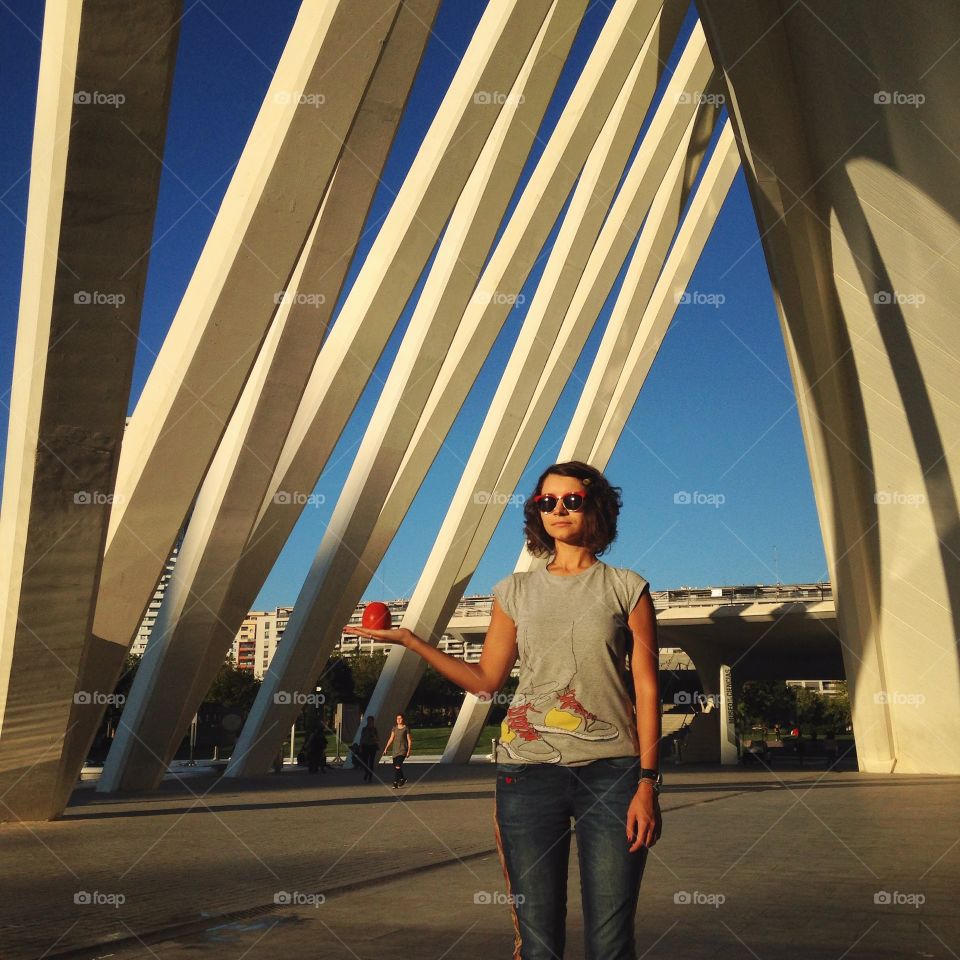 Brunette holding fruit in Valencia  