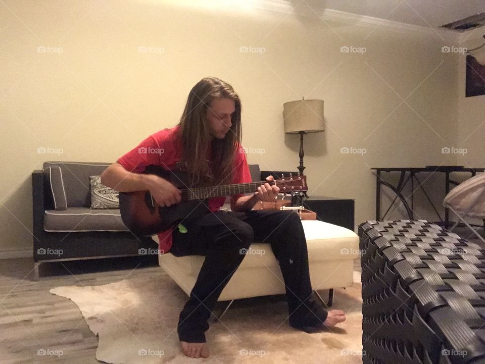 No filter. No edit. Not needed (i think lol). Playing the guitar on a rainy day. Always practicing. Working on better vocal cords. Still shot. 