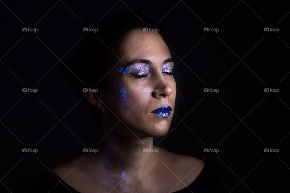 Portrait of a young woman wearing a make up 