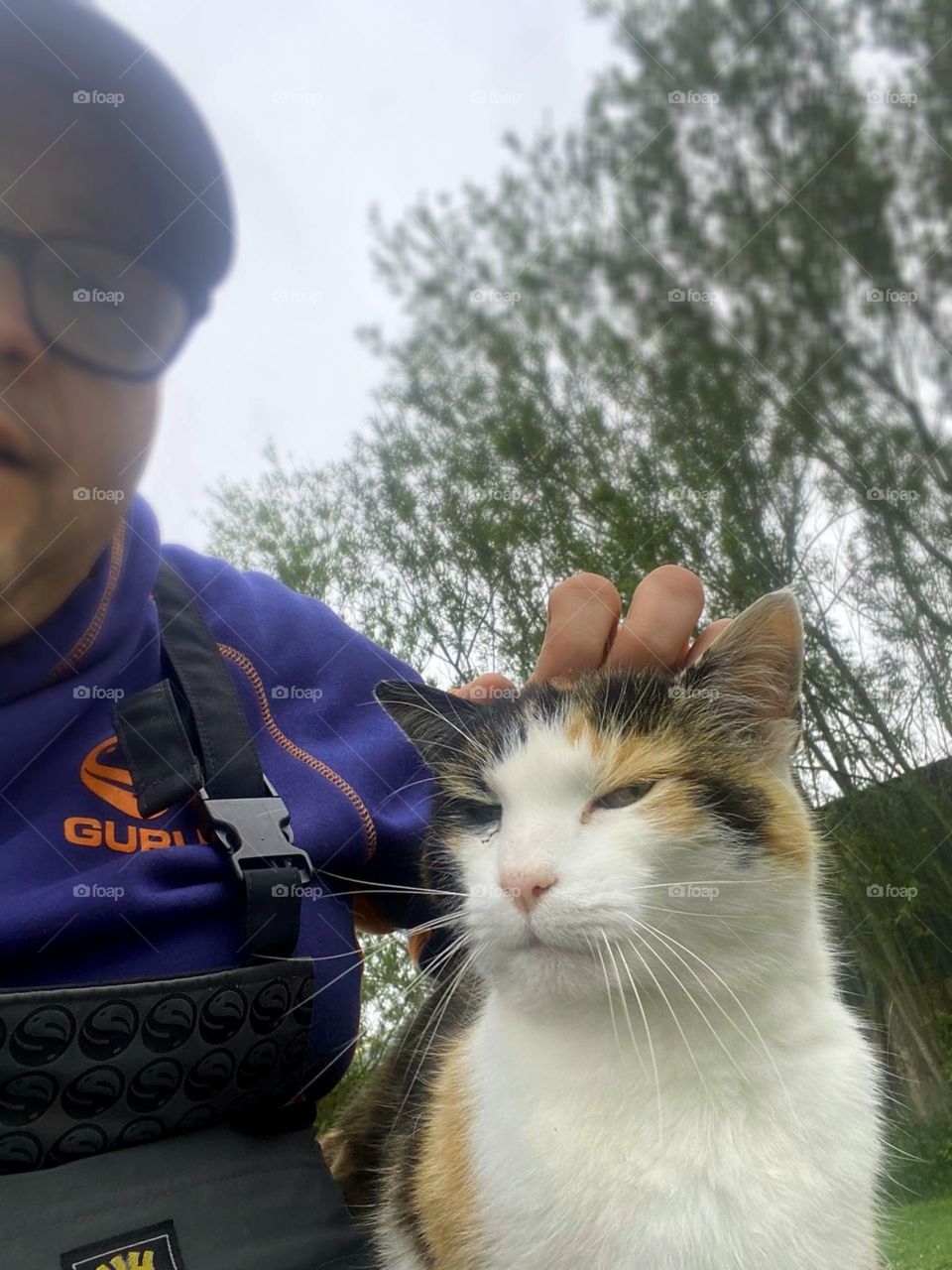 Out fishing for the day and this cat has made a friend and also taking a interest in the fish which are being caught