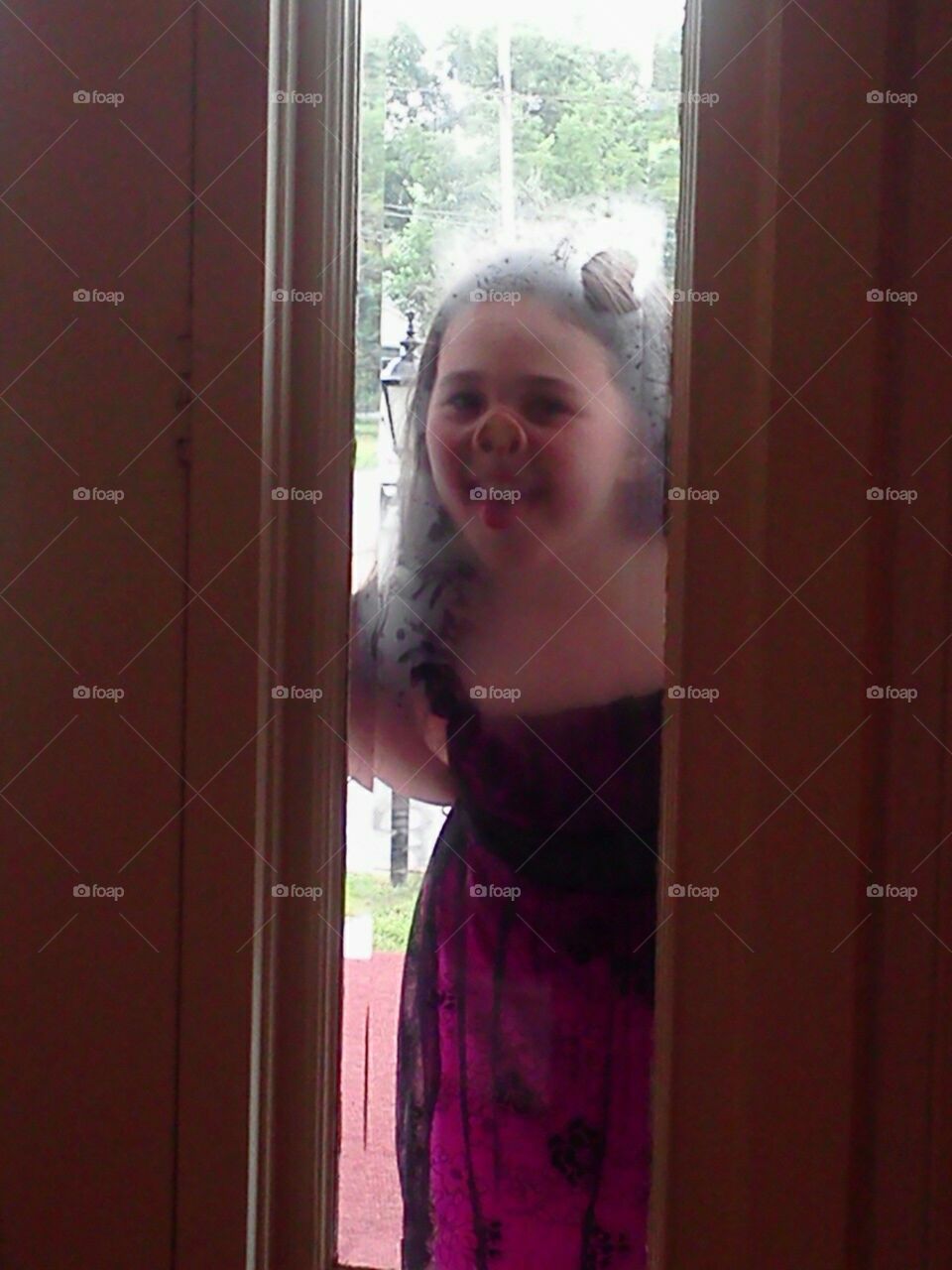 funny face. while at my grandmothers funeral I look up to see my 6 year old granddaughter with her nose pressed to the window :)