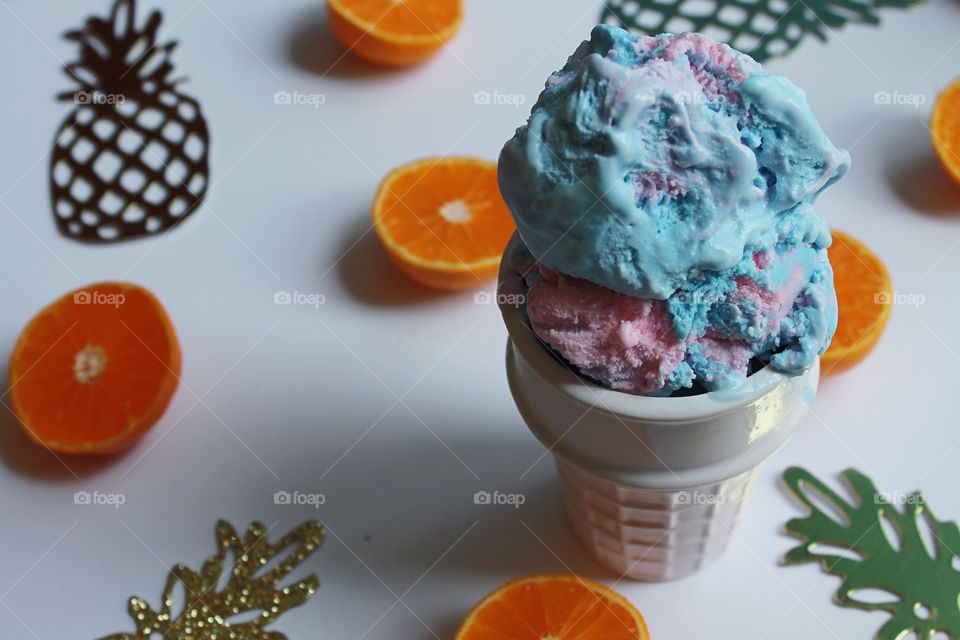 Ice cream and halved orange fruits