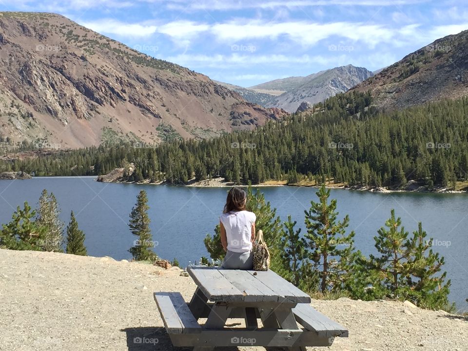 Sitting in front of a beautiful landscape