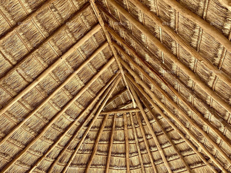 A roof made out of wood and straw