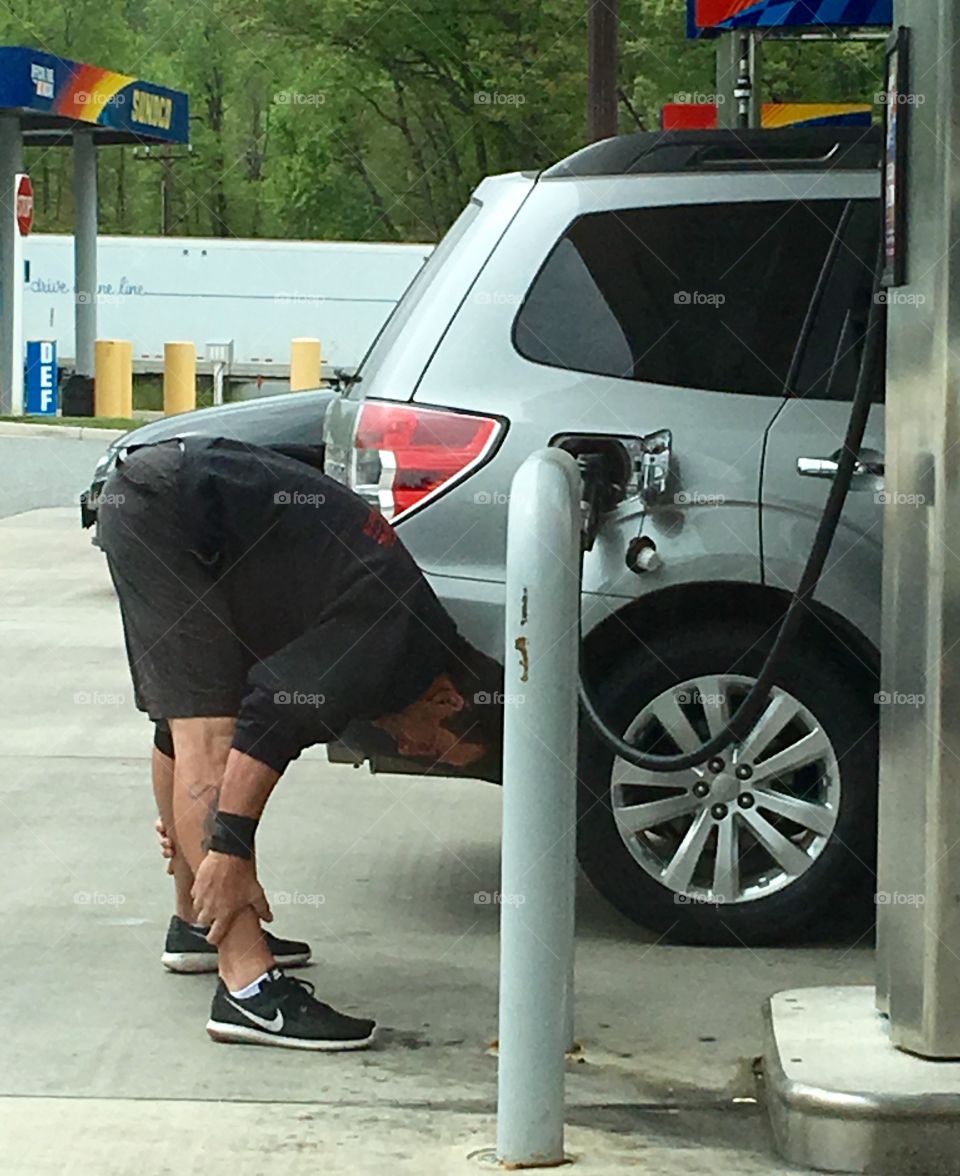 Gas Tank Filling, Stretching While Waiting