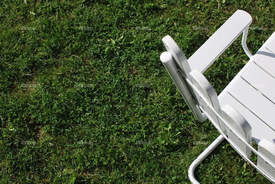 White stool on grass