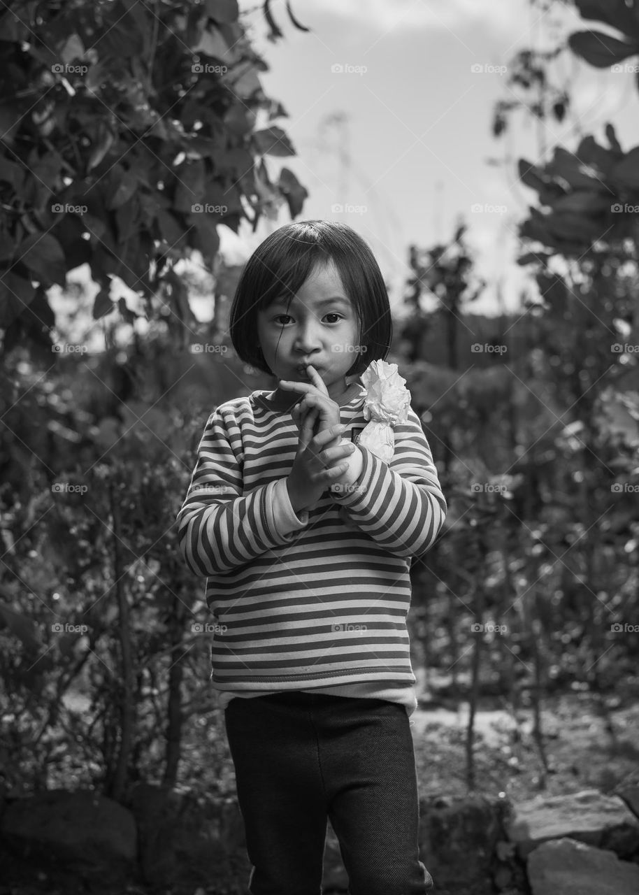 Black and white portrait of a little girl.