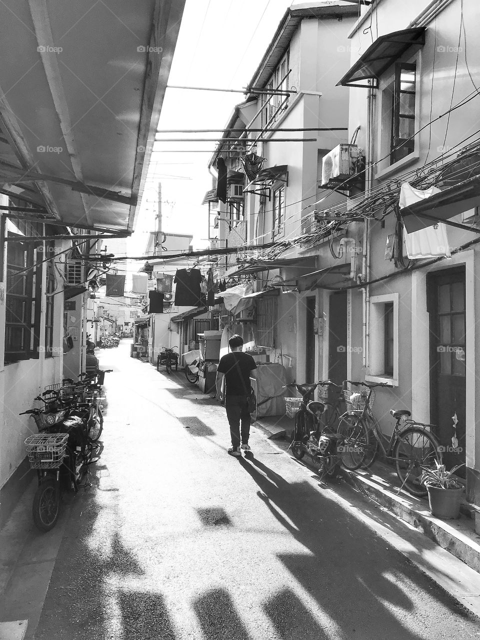 Black and white snap of the morning streets of old Shanghai - the area of Laoximen 