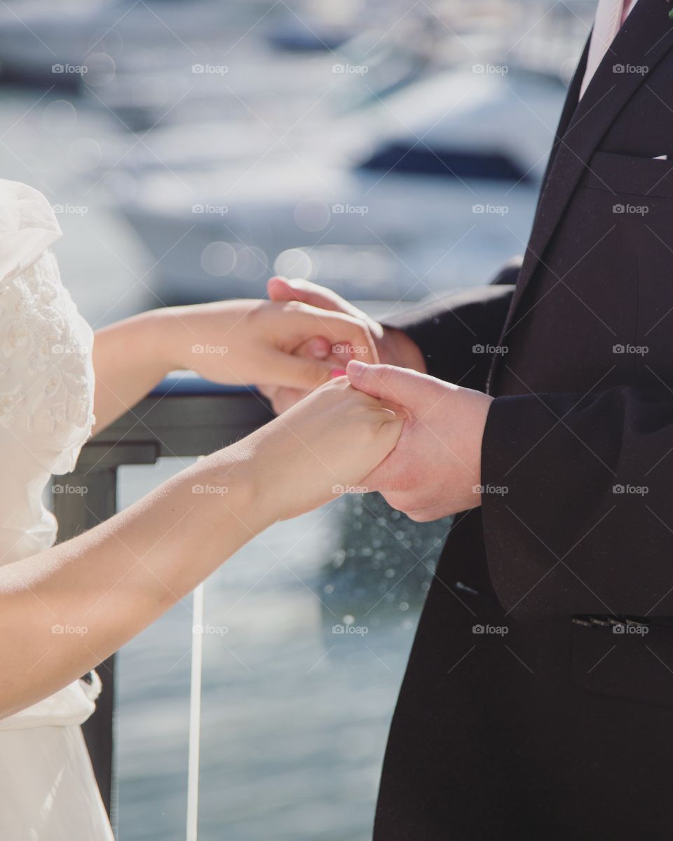 Bride and groom holding hands