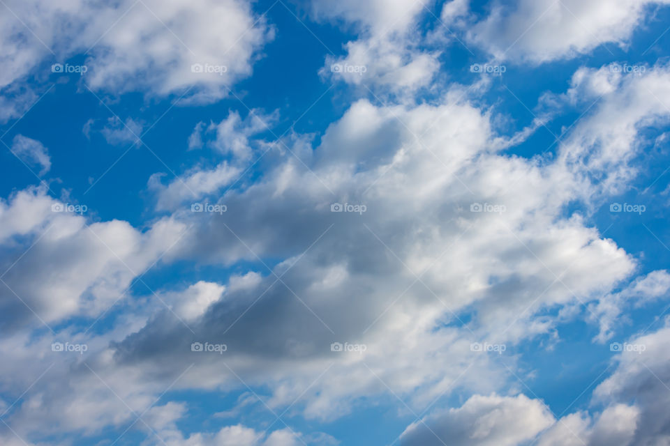 The beauty of the sky with clouds and the sun.