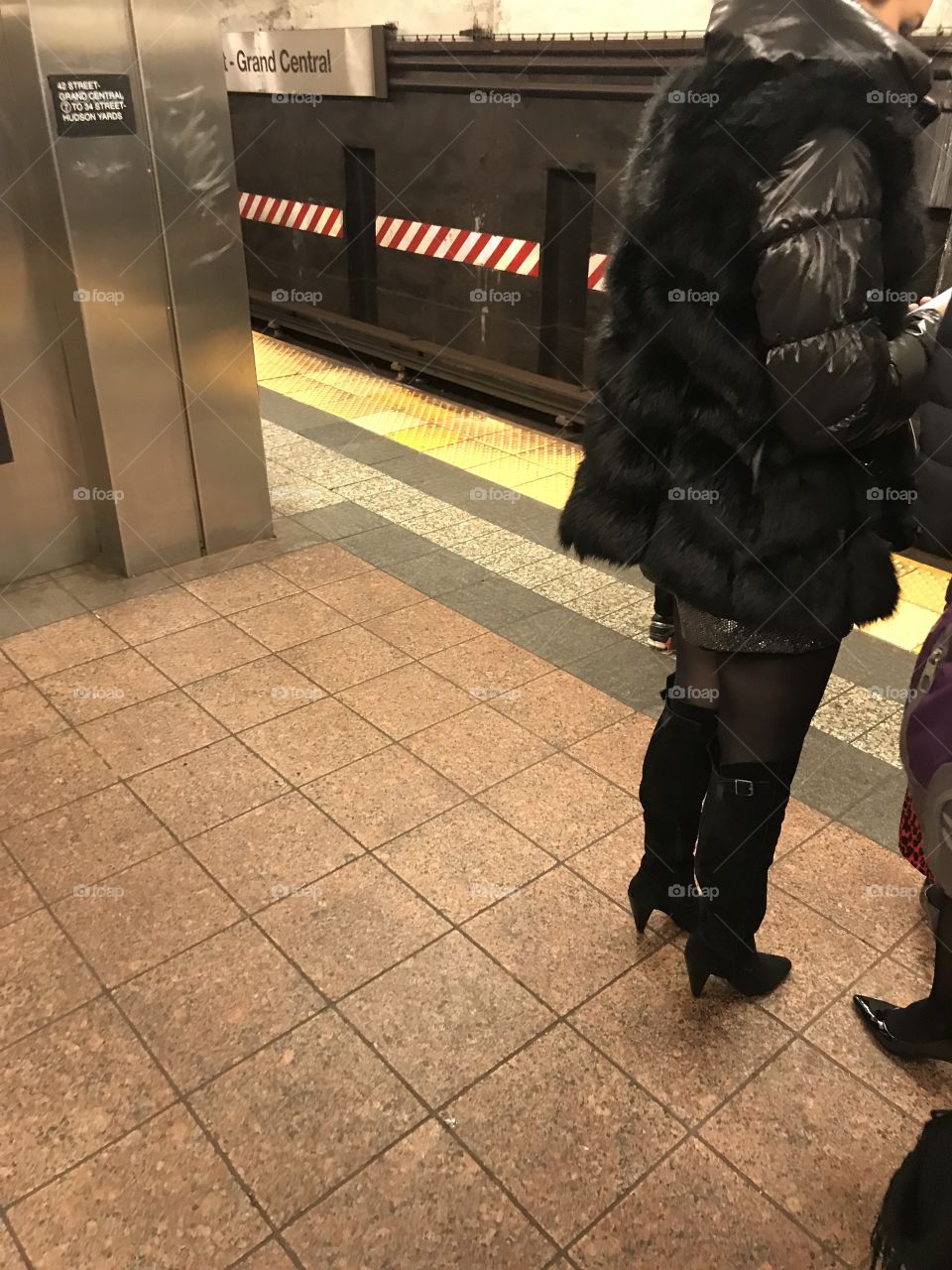 Glamorous legs, glamorous boots, glamorous lady.