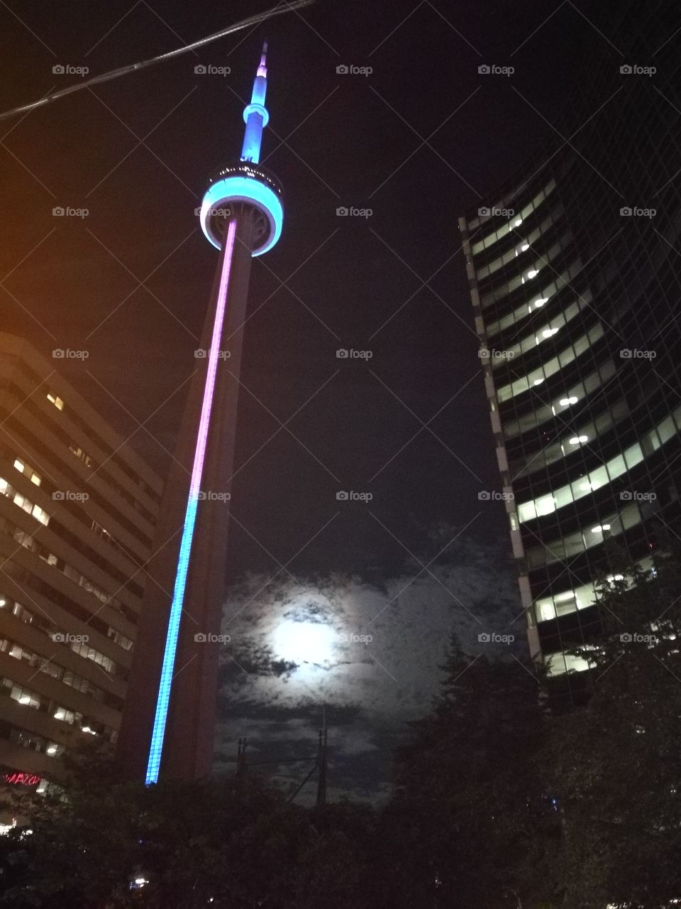 Downtown Toronto, CN Tower with moonlight on the background