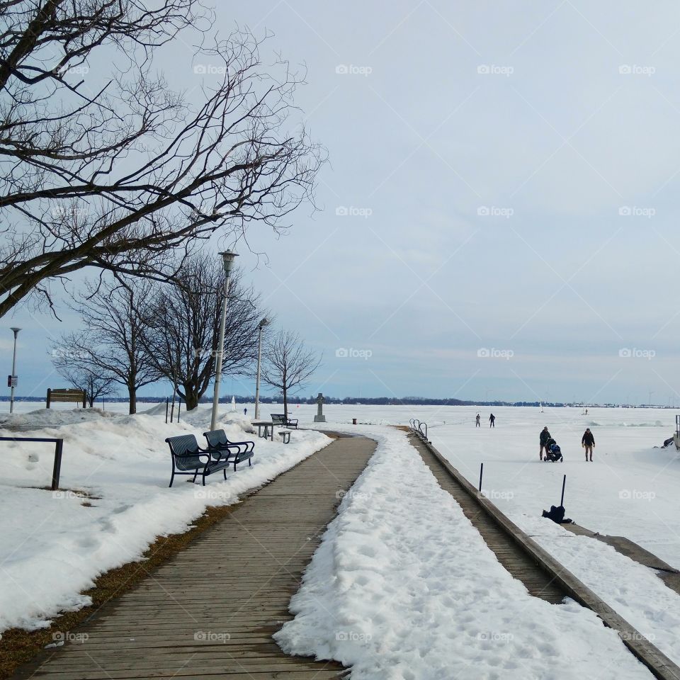 People walking on frozen lake