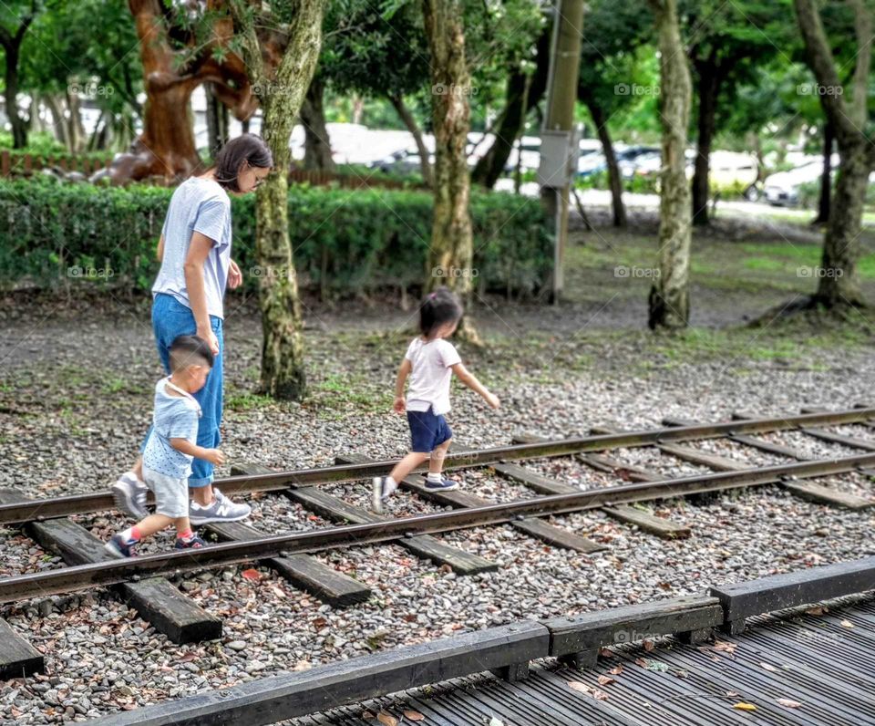 The children were playing on the abandoned railway in forestry park.