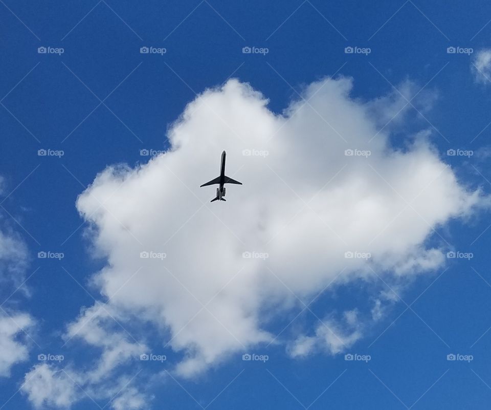 plane in the beautiful clouds