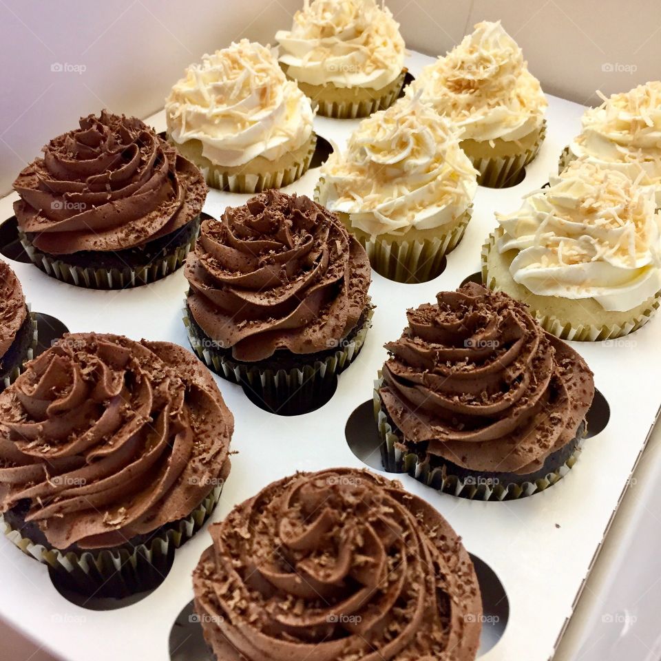 Close-up of chocolate and vanilla cupcakes