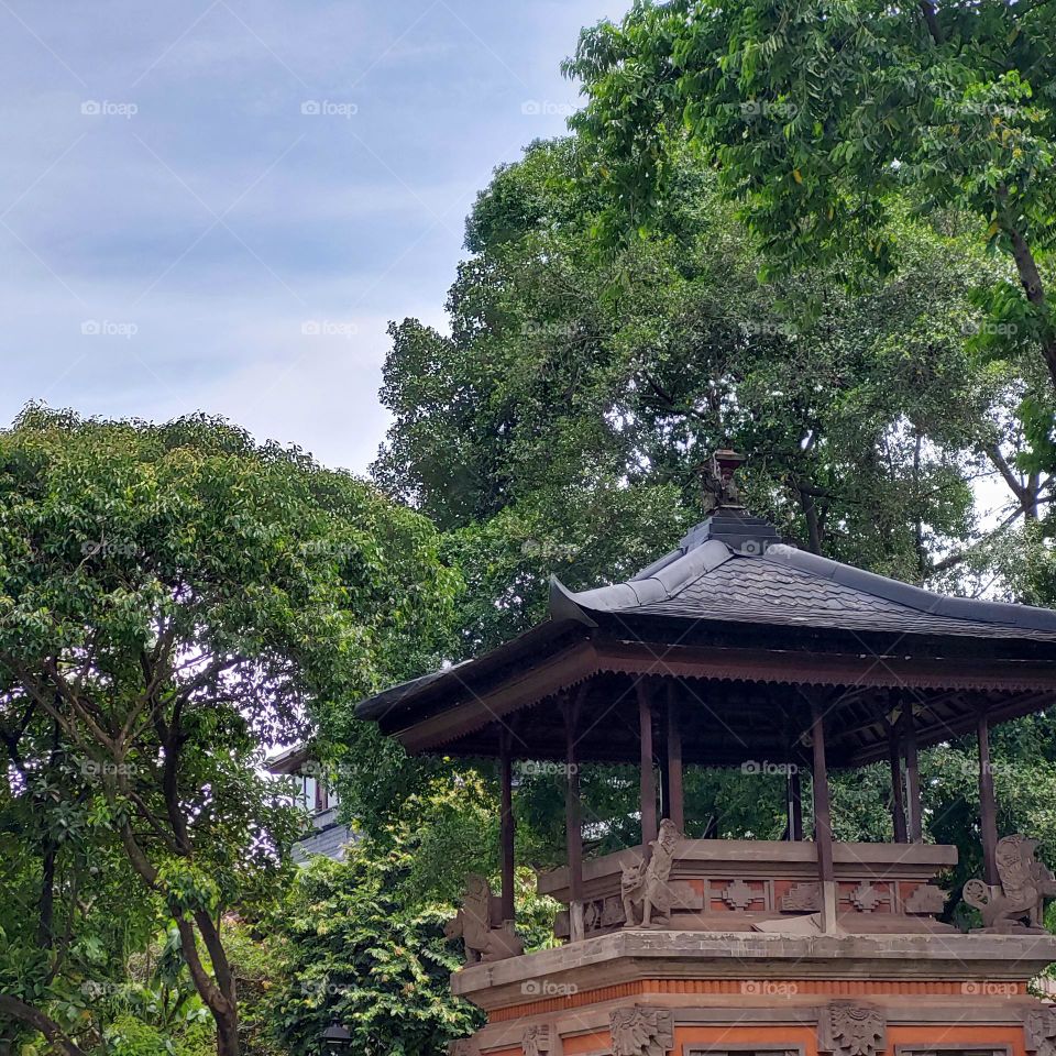 Balinese ornament building among shady trees