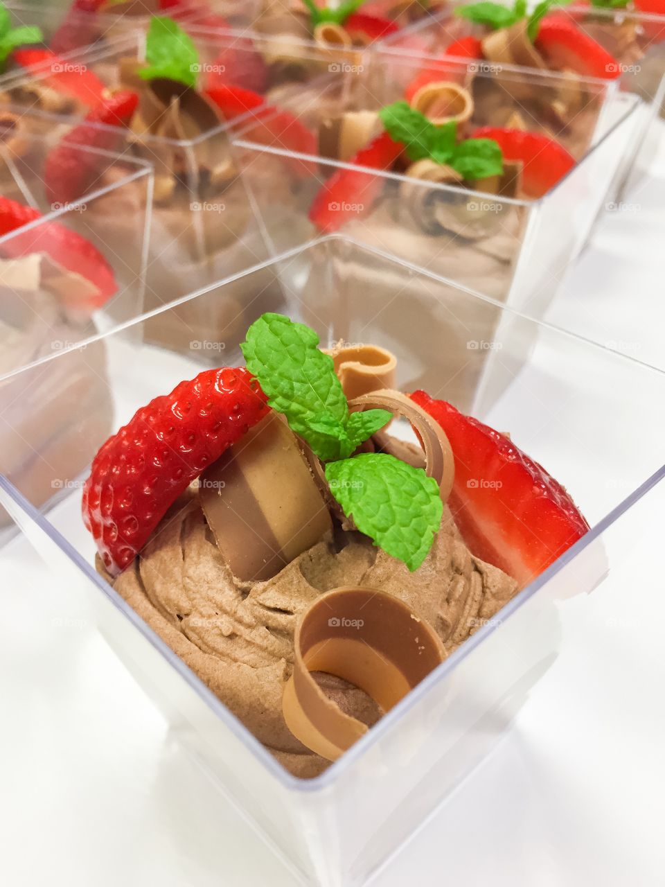 Chocolate mousse dessert with strawberries.