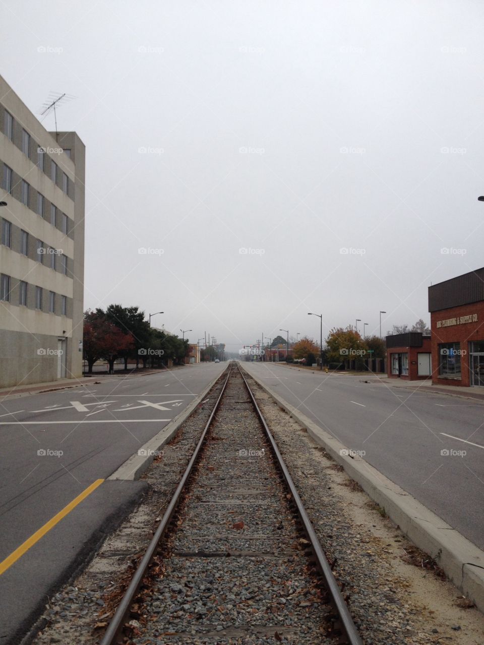 Downtown train tracks. Train tracks alongside road in downtown Fayetteville, NC.