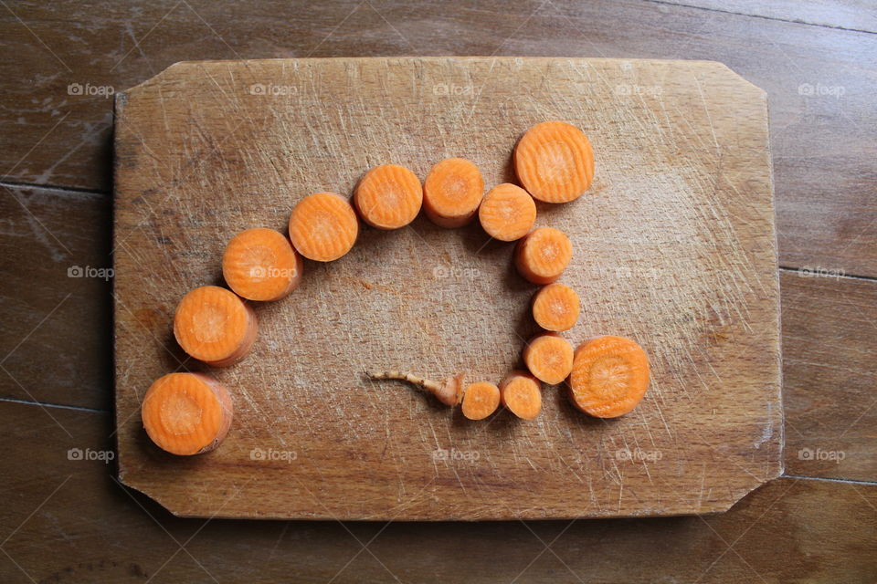 cut carrot on wooden table