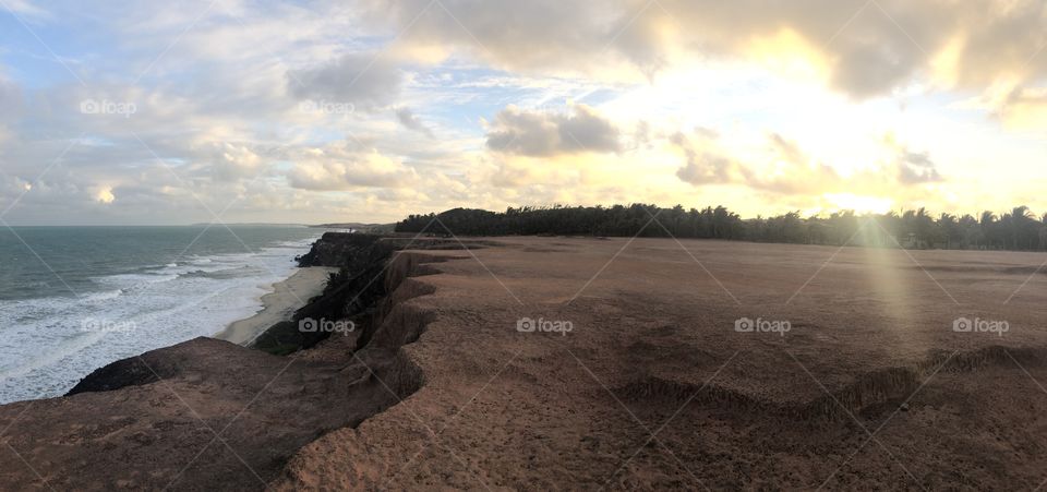 Sunset, the cliff and the ocean