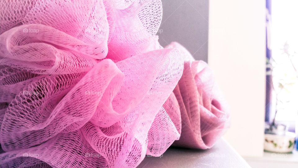 Pink bathing sponge