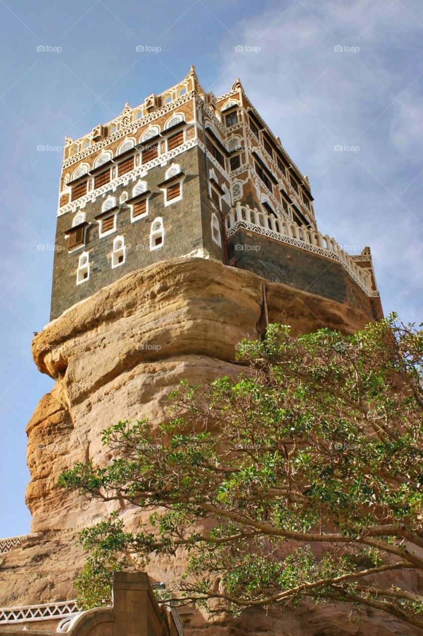 A stunning view of green mountains covered in fog in Yemen