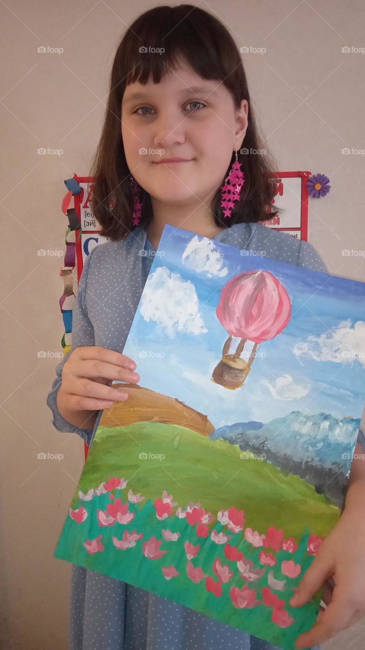 Сute girl with her drawing