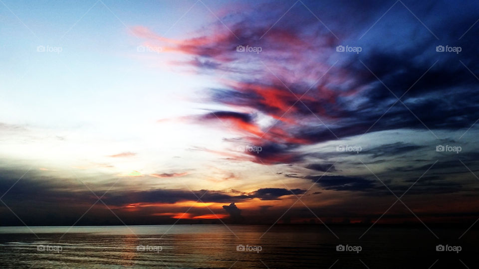 Could be both sunset and sunrise or even storm is coming. Love that amazing of nature created. Cha-Am Petchaburi.