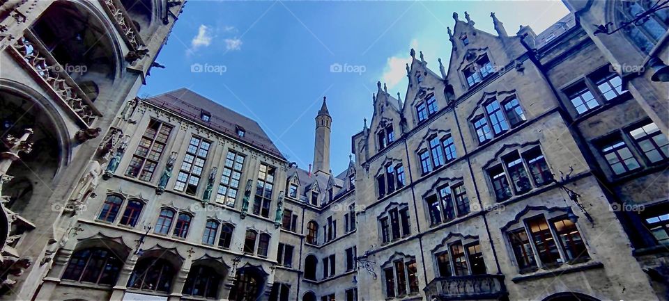 This is the inside view of the old „Rathaus“ in „Munich“, Germany. The landmark building has lavishly decorated gothic facades with  towers and extends over several adjacent buildings that surround a courtyard. 2023. Hypnotic Productions