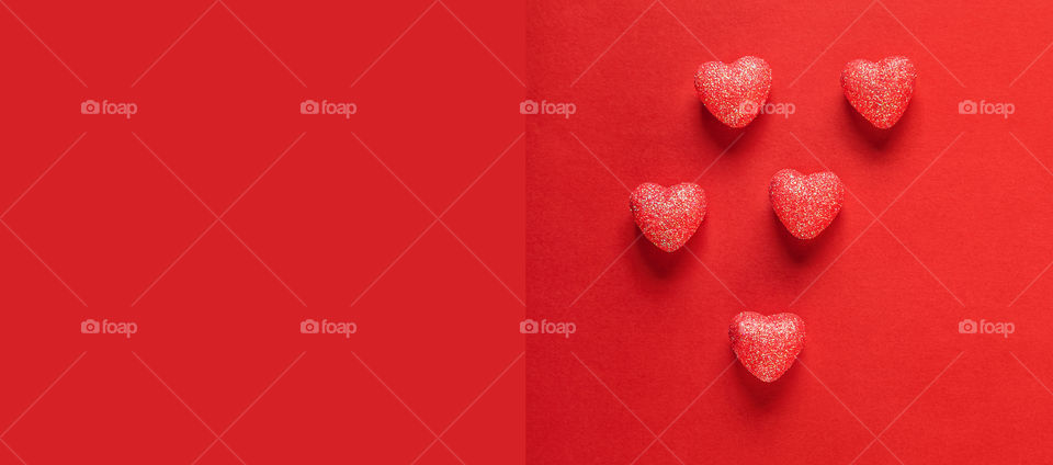 Postcard. Red hearts on a red background. Valentine's Day.