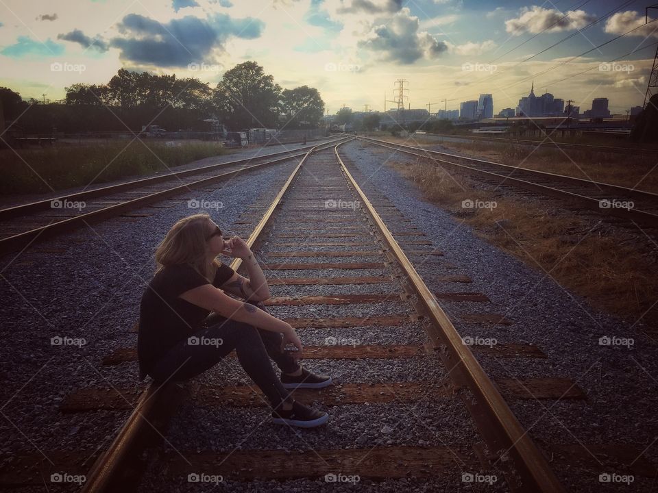 Girl on train tracks 