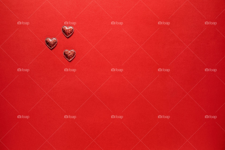 Red hearts on a red background. Valentine's Day. Postcard. Red pepper.