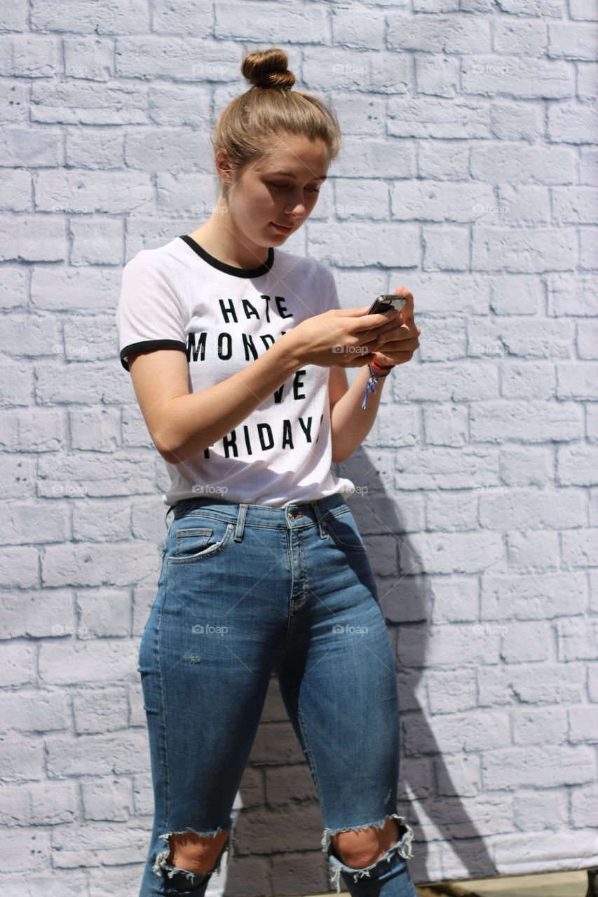 Young woman using cellphone