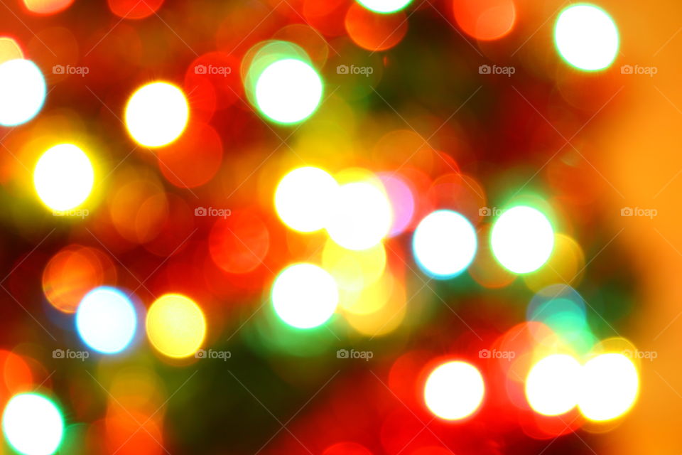 Macro shot of Christmas tree decorations and vivid lights