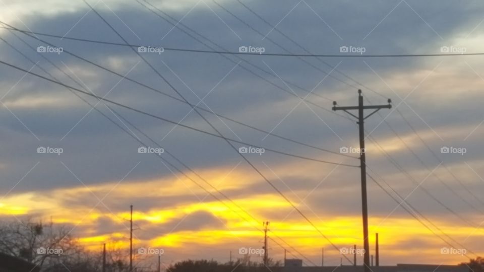 Beautiful Texas sky at sunset with power lines