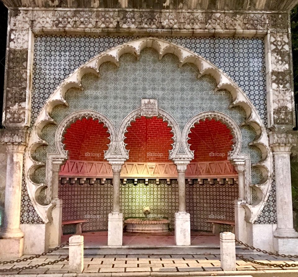 Antique fountain in Arabic palace style Sintra Portugal. Covered in beautiful tiles - the local art.